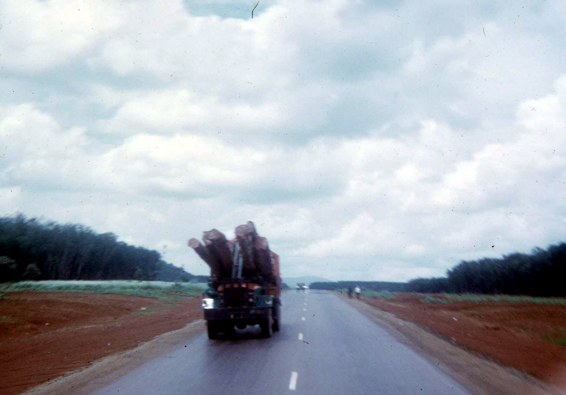 Logging trucks on Highway 1, en route to Fanning