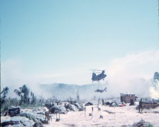 Chinook slinging a backhoe out of FSB Silver