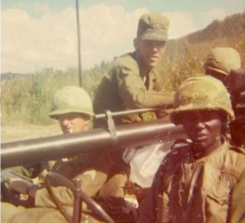 Paul Malec and fellow troopers on a jeep