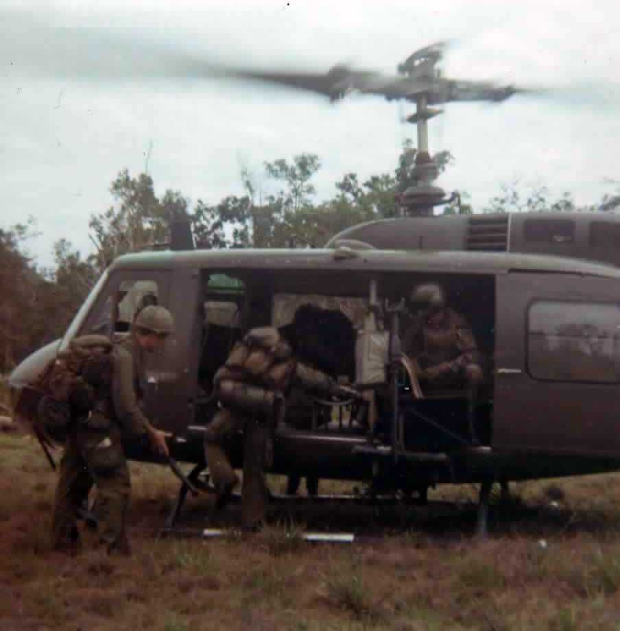Air assault insertion — soldiers loading a UH-1