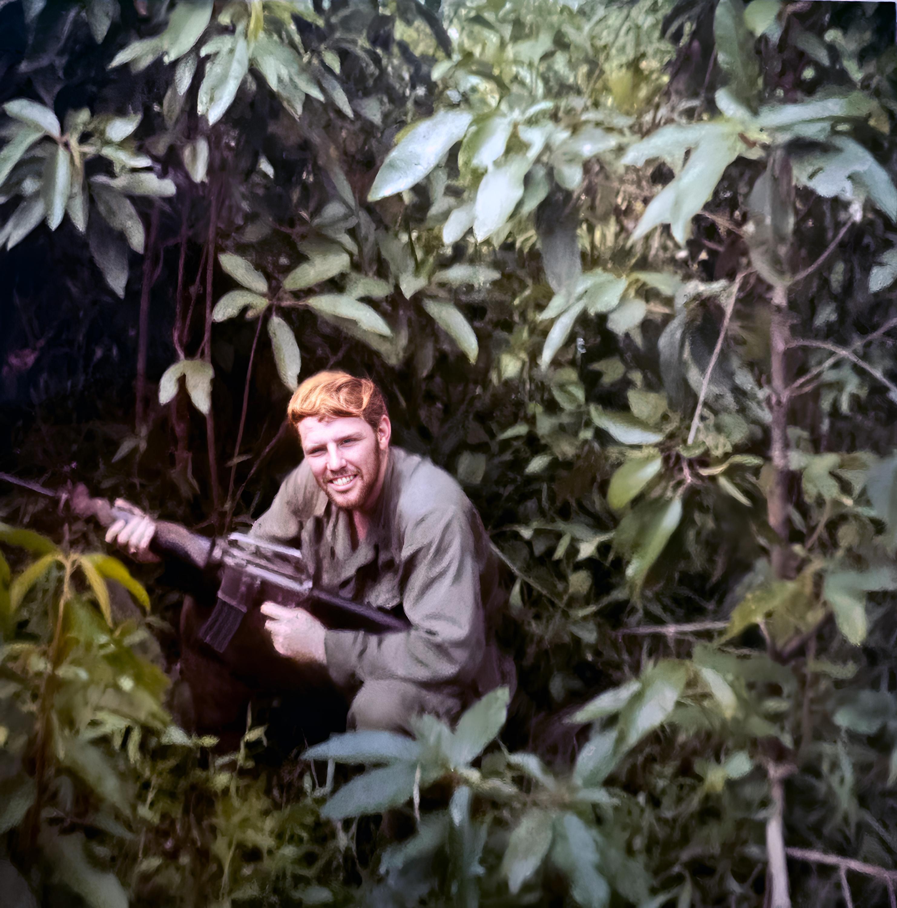 Marvin Miller with his M16 in the bush. 