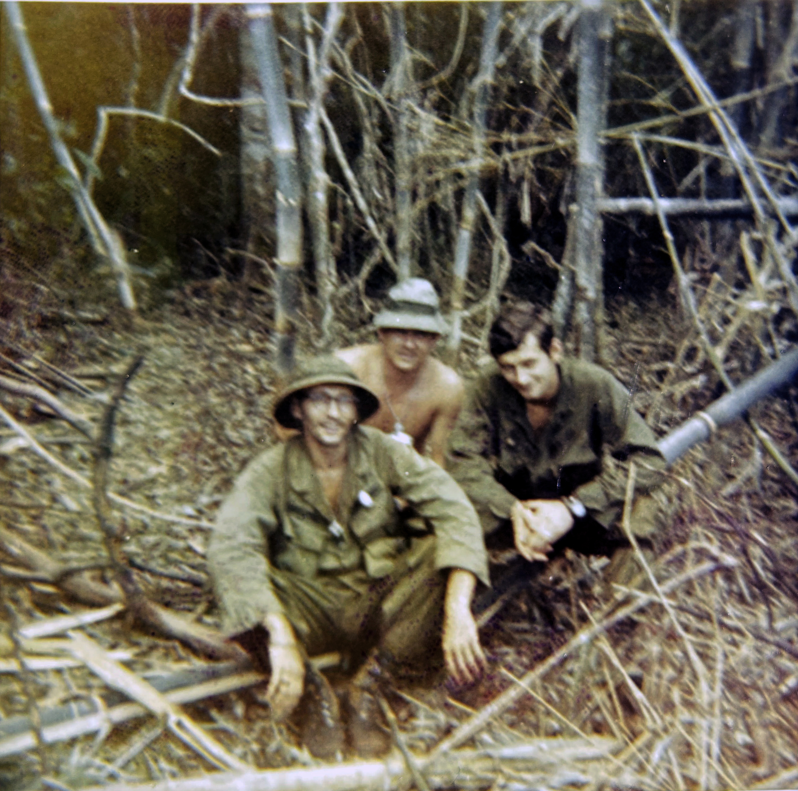 Three GIs in the bush.