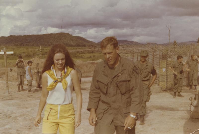 Col. Blagg walking with a USO performer