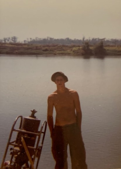 Thomas Wood taking a break near a small lake