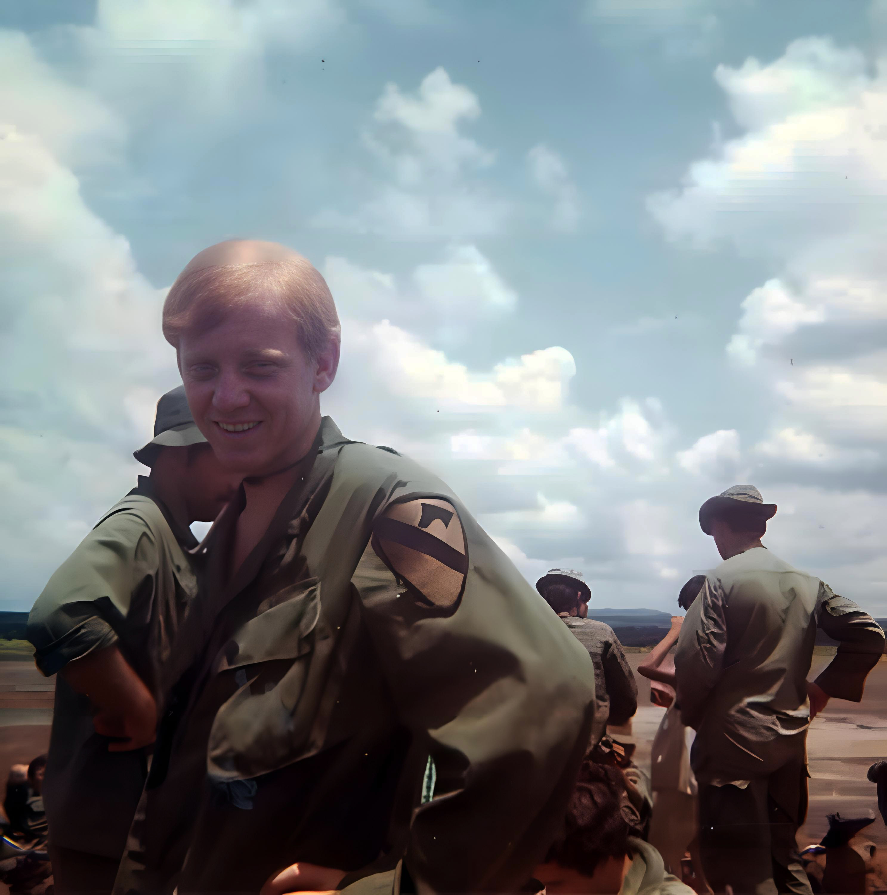 Bill Small in the field — 1st Cav patch visible · Photo by Ken Weaver